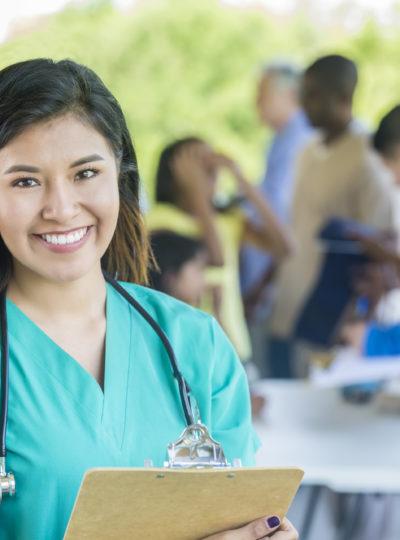 Nurse smiles at the camera